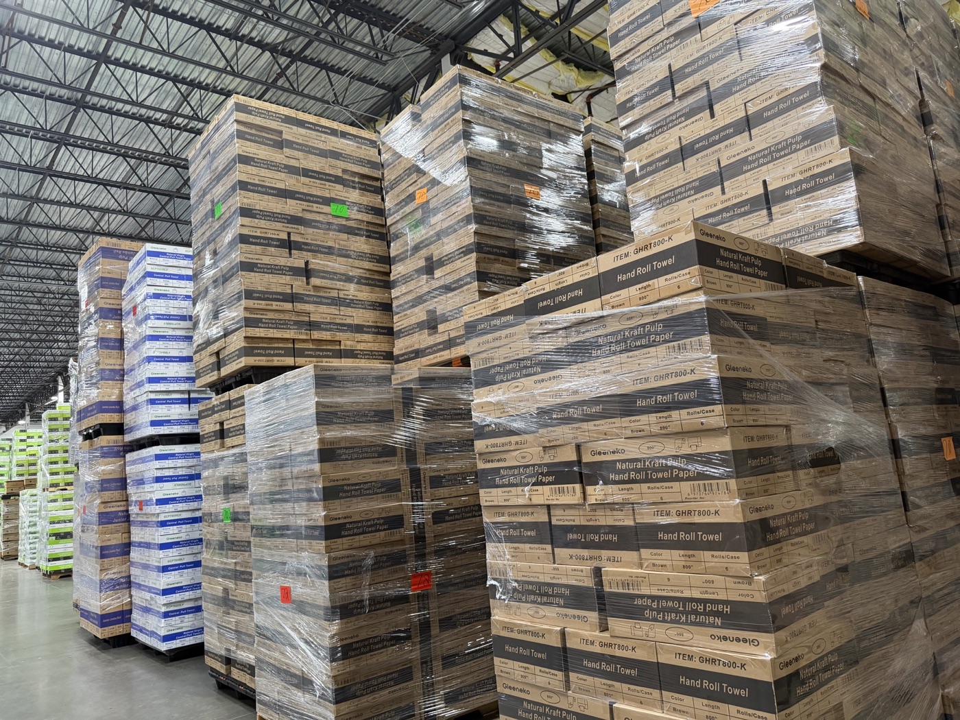 Palletized BAYPLUS paper products stocked in a Houston-area warehouse